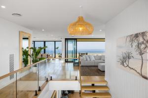 a living room with a view of the ocean at Island View San Remo in San Remo