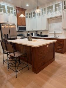 a kitchen with a large island in the middle at Dream Casa Blanca in Harlingen