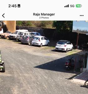 a photo of cars parked in a parking lot at Sagar hotel and guest house in Sāgar