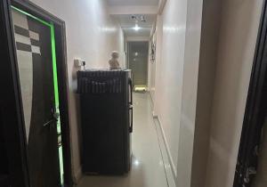 a hallway with a small child standing in a room at Sagar hotel and guest house in Sāgar