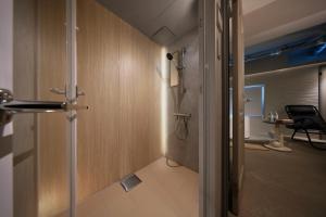 a bathroom with a shower and a walk in showeroser at クリスタルサウナ in Miyako-jima
