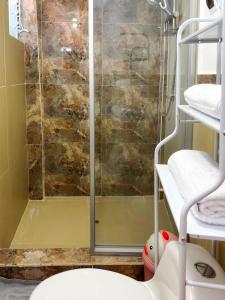 a shower with a glass door in a bathroom at Nice Apartment in Urubamba in Urubamba +31 photos