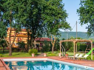 a pool with a swing and a gazebo at Mansion with Pool and play area in Pian di Scò