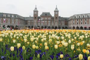 a field of flowers in front of a building at Kobe Hotel Fruit Flower in Kobe