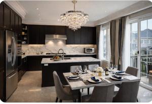 a kitchen with a table with chairs and a chandelier at Quite Cozy Private Room In Vaughan with Private Bathroom and Free Parking in Vaughan