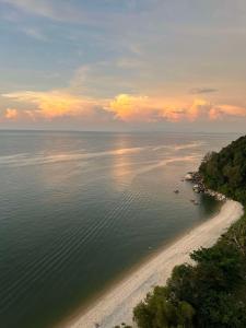 an aerial view of a beach at sunset at Angsana Teluk Bahang, Penang in Batu Ferringhi +128 photos