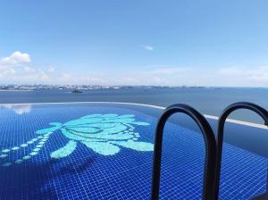 a swimming pool with a flower painted on it at Forest City Eco Stay in Gelang Patah +50 photos