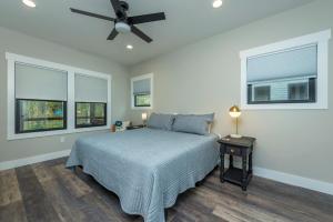 a bedroom with a bed and a ceiling fan at Roam Inn in Black Mountain