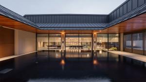 a swimming pool in the middle of a house at Mungyeong Sadamjae Stay in Mungyeong