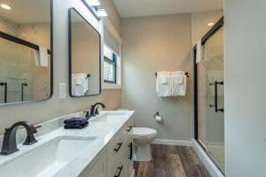 a bathroom with a sink and a toilet and a shower at Roam Inn in Black Mountain +32 photos