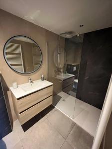 a bathroom with a sink and a mirror at Au Coin des Sources B&B Sart-lez-Spa in Sart-lez-Spa +36 photos