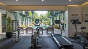 a gym with treadmills and cardio equipment in a building at Park 5 Cilandak in Jakarta