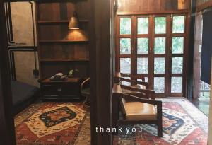 a room with a desk and chairs and a phone at mr handsome phayao in Ban Mae Ka Hua Thung