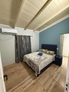 a bedroom with a bed in a room at departamento luck in Puerto Iguazú