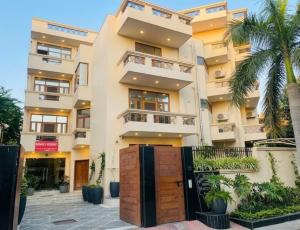 an apartment building with a gate in front of it at Monarch Residency Gurgaon in Gurgaon
