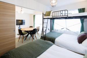 Gulta vai gultas numurā naktsmītnē Hotel Hs Park Chitose