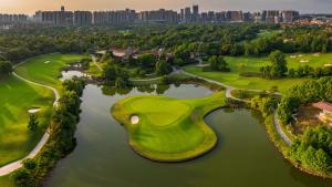 an aerial view of a golf course on the water at The Ritz-Carlton, Chengdu in Chengdu