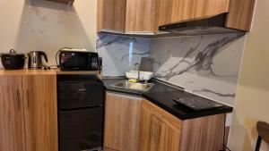a kitchen with a sink and a counter top at Ann's Haven in Cebu City
