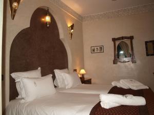 Postel nebo postele na pokoji v ubytování Riad Belle Epoque