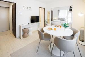 Televizors / izklaižu centrs naktsmītnē Hotel Hs Park Chitose