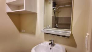 a bathroom with a sink and a mirror at Ann's Haven in Cebu City +12 photos
