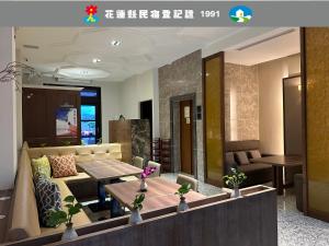 a living room with a couch and a table at The Greenery B&B in Hualien City
