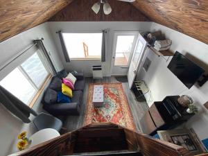 an overhead view of a living room with a couch at Blue Moose Cabin at Moose Tracks Lodging in Kenai