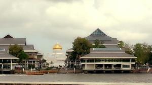 a building with a gold dome on top of it at Kunyit 7 Lodge in Bandar Seri Begawan