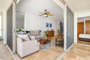 a living room with a couch and a table at Ocean-view condo with resort pool & sundeck in Nuevo Vallarta