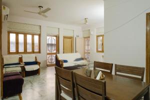 a dining room with a table and chairs at Luxury 2 Bedroom's Appartment in Rishīkesh