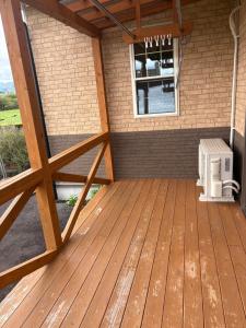 an outdoor deck with a heater and a window at ラフォーレハウス in Hitoyoshi +7 photos