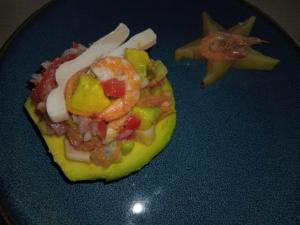 a piece of food with shrimp and vegetables on a plate at VILLA Paradisakely in Nosy Be +37 photos