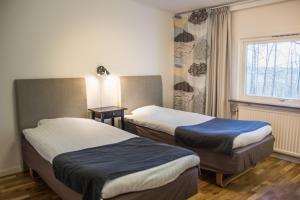 Postel nebo postele na pokoji v ubytování Sjögestad Motell + 37 fotografií