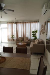 a living room with a couch and a table at Departamento zona central in La Paz