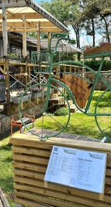 a green roller coaster in a park at Trädgårdscafé Pedalen B&B in Halmstad