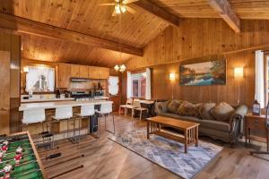 a living room with a couch and a table at 2583-Bernhardt Brown Bungalow in Big Bear City