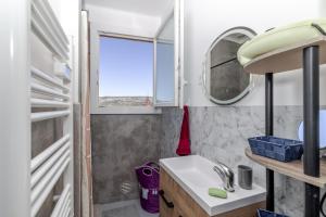 a small bathroom with a sink and a mirror at Appart cathare et l'olivier in Tautavel +34 photos