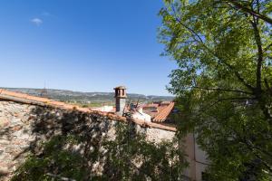 a view from the top of a stone wall with trees at Appart cathare et l'olivier in Tautavel