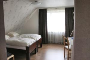 Postel nebo postele na pokoji v ubytování Orchidee Altenau