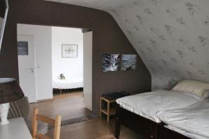 Postel nebo postele na pokoji v ubytování Orchidee Altenau