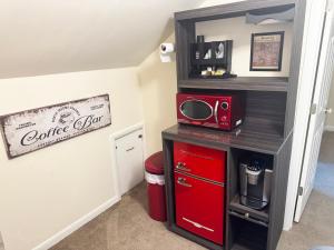 a room with a red cabinet with a red appliance at You Deserve the Best! in Tacoma