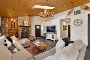 a living room with a couch and a fireplace at 2614 - Cielos Nest in Big Bear Lake