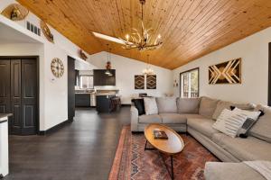 a living room with a couch and a table at 2614 - Cielos Nest in Big Bear Lake