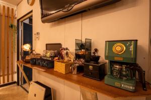 a counter with a coffee maker on top of it at SaKuRa B&B in Sakura +20 photos