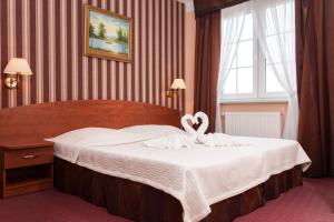 Postel nebo postele na pokoji v ubytování Bałtyk Resort