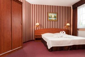 Postel nebo postele na pokoji v ubytování Bałtyk Resort