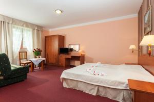 Postel nebo postele na pokoji v ubytování Bałtyk Resort