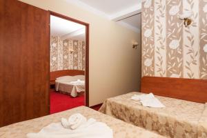 Postel nebo postele na pokoji v ubytování Bałtyk Resort