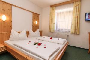 Łóżko lub łóżka w pokoju w obiekcie Appartements Trinker