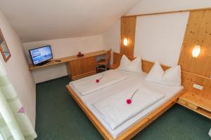 Łóżko lub łóżka w pokoju w obiekcie Appartements Trinker